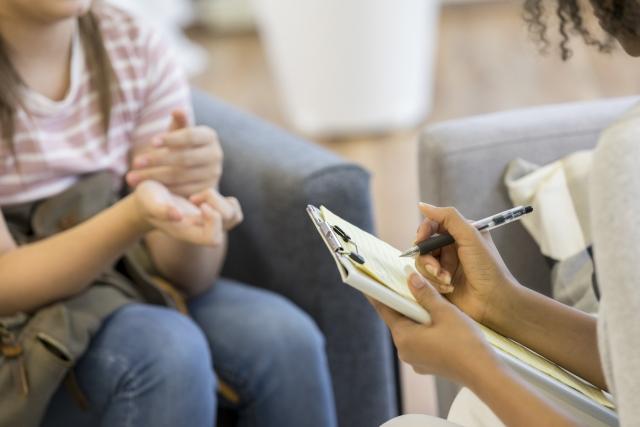 A young patient speaks with a doctor