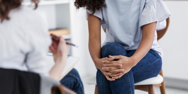 A patient works with a doctor in therapy