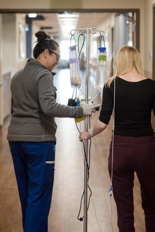 Nurse walking with patient
