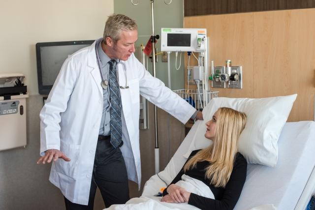 Doctor talking with patient