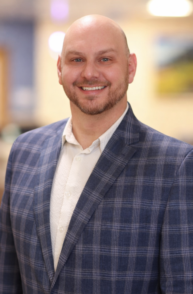 Headshot of Adam Leggett